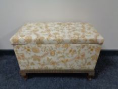 An early 20th century pine floral upholstered storage Ottoman