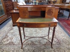 An inlaid mahogany escritoire with green leather inset panel on reeded legs