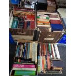 Four boxes containing assorted books to include Penguin paperback novels, Tolkien, reference etc.