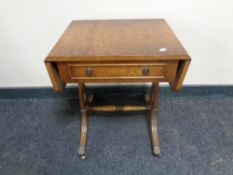 A walnut sofa occasional table fitted a drawer