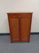 A twentieth century pine double door cabinet,