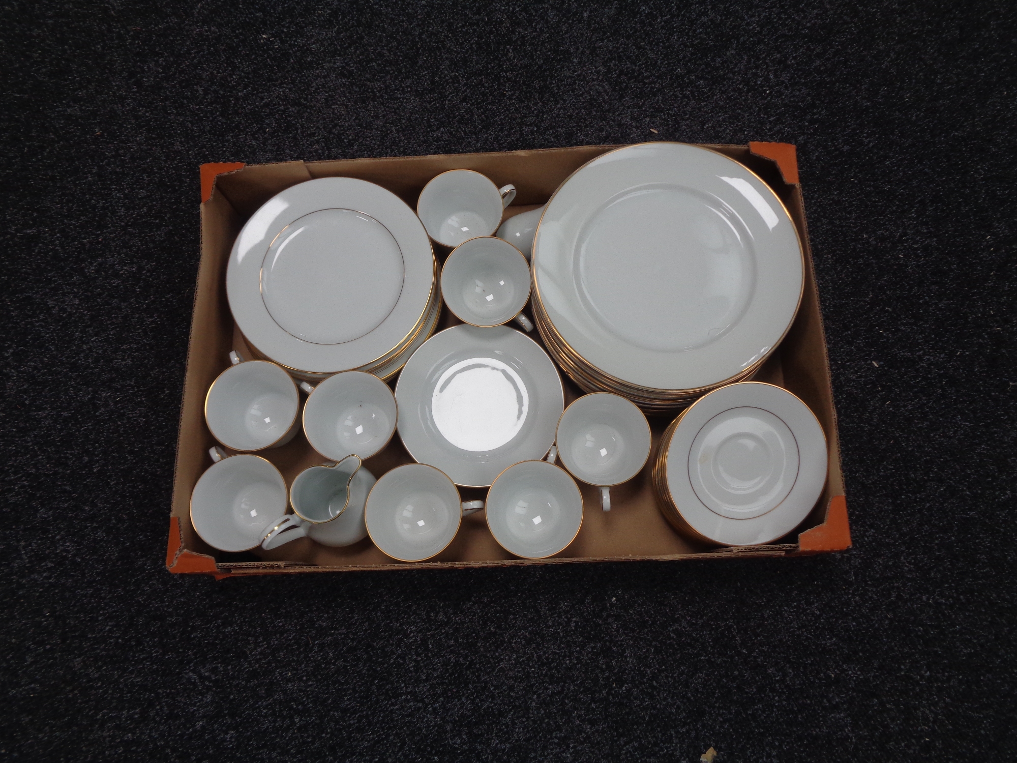 A box of Noritake Regency gold tea and dinner service