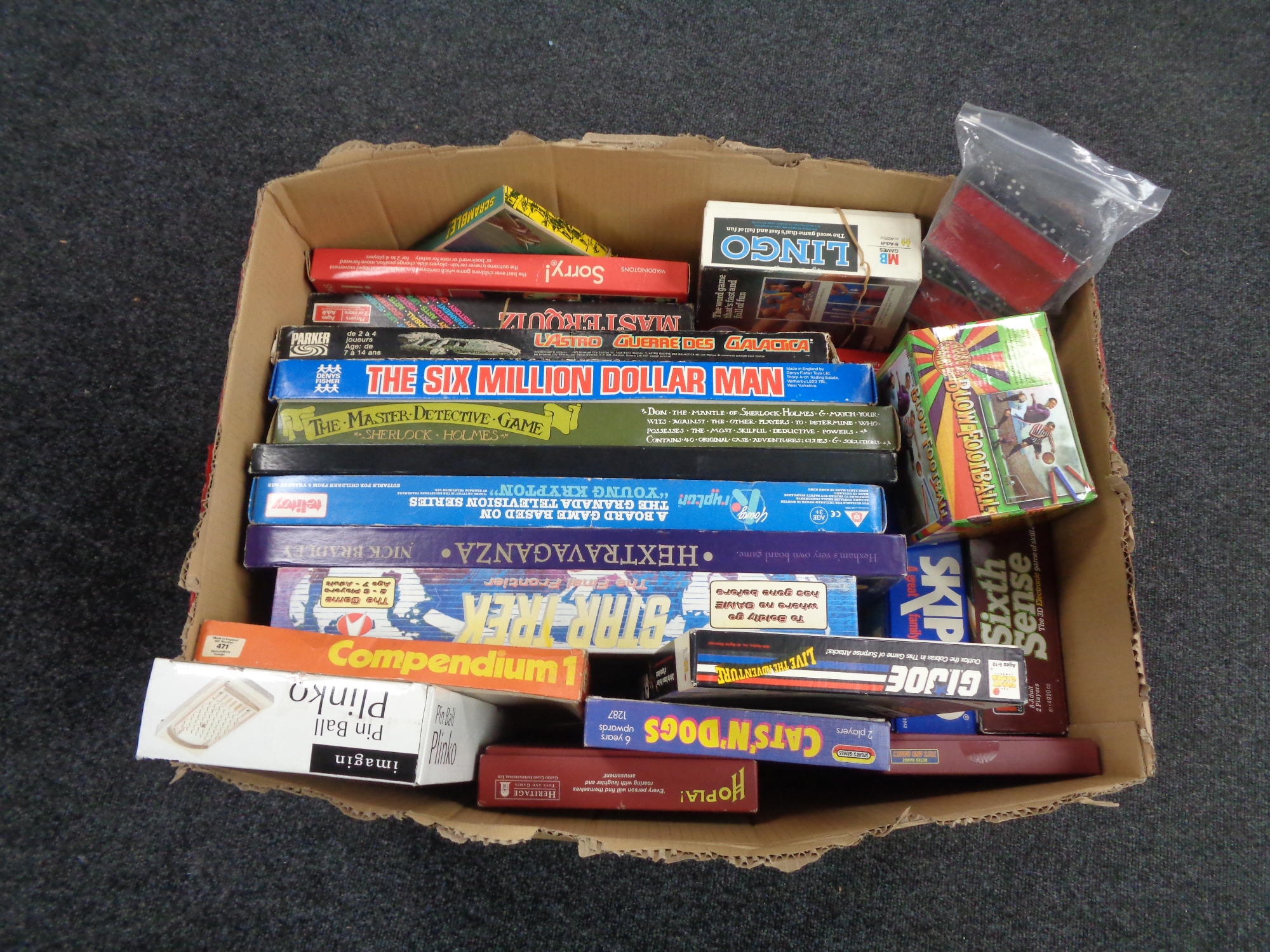 A box of vintage and later board games to include Battle Star Galactica, Star Trek,