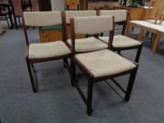 A set of four mid century German dining chairs in beige fabric