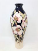 A modern Moorcroft 'Hellebore' pattern baluster vase, designed by Nicola Slaney,