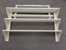 Two painted wall racks