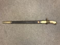 A 19th century German hunting sword a/f CONDITION REPORT: Blade seized in scabbard.