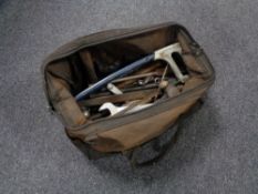 A vintage holdall of hand tools, folding wooden rule, ring spanners,