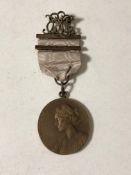 An early twentieth century East Lincolnshire musical medal on ribbon.