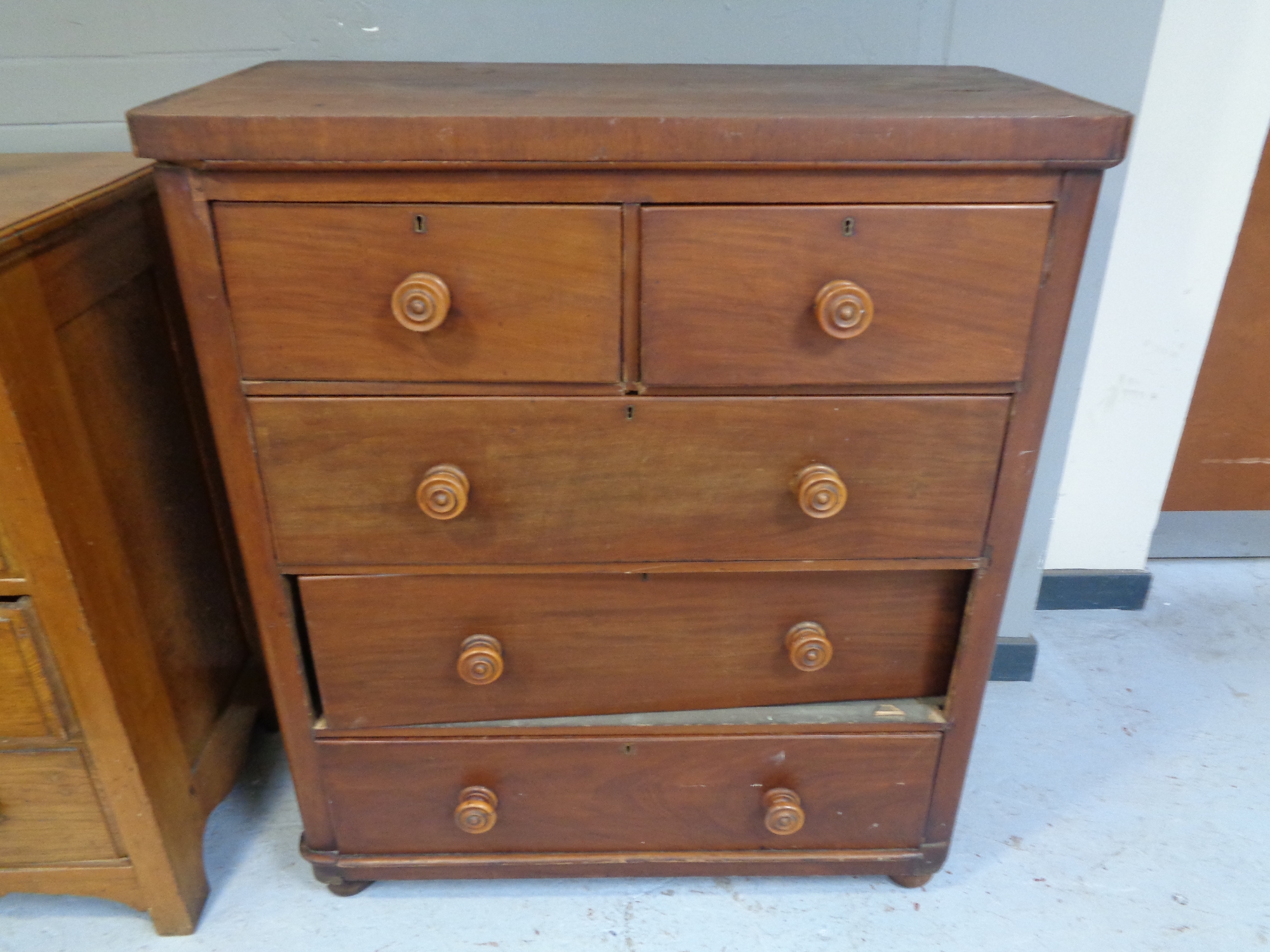 A Victorian pine five drawer chest