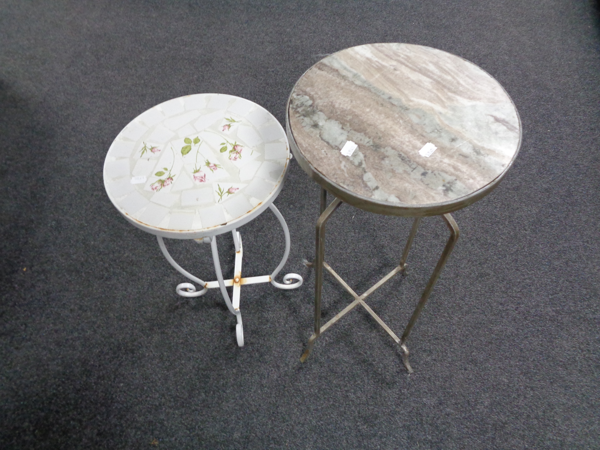 A metal marble top plant stand together with a further metal tile topped plant stand.