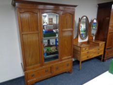 A 19th century inlaid mahogany mirror door wardrobe fitted two drawers beneath