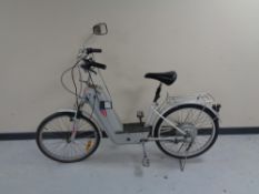 A Powabyke electric bike with key and charger.