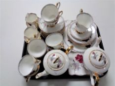 A tray of thirty six pieces of Royal Stafford Roses to Remember bone tea china