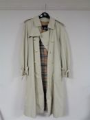 A Gents Burberry three quarter length coat with Burberry check and woolen lining,