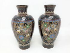 A pair of early 20th century cloisonne vases decorated with panels of butterflies, height 15 cm.