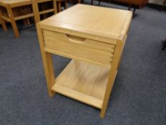 A contemporary two tier lamp table, fitted a drawer.