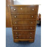 A mid 20th century six drawer chest.