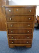 A mid 20th century six drawer chest.