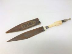 An antique Somalian Billa knife with ivory and horn hilt, in leather sheath.