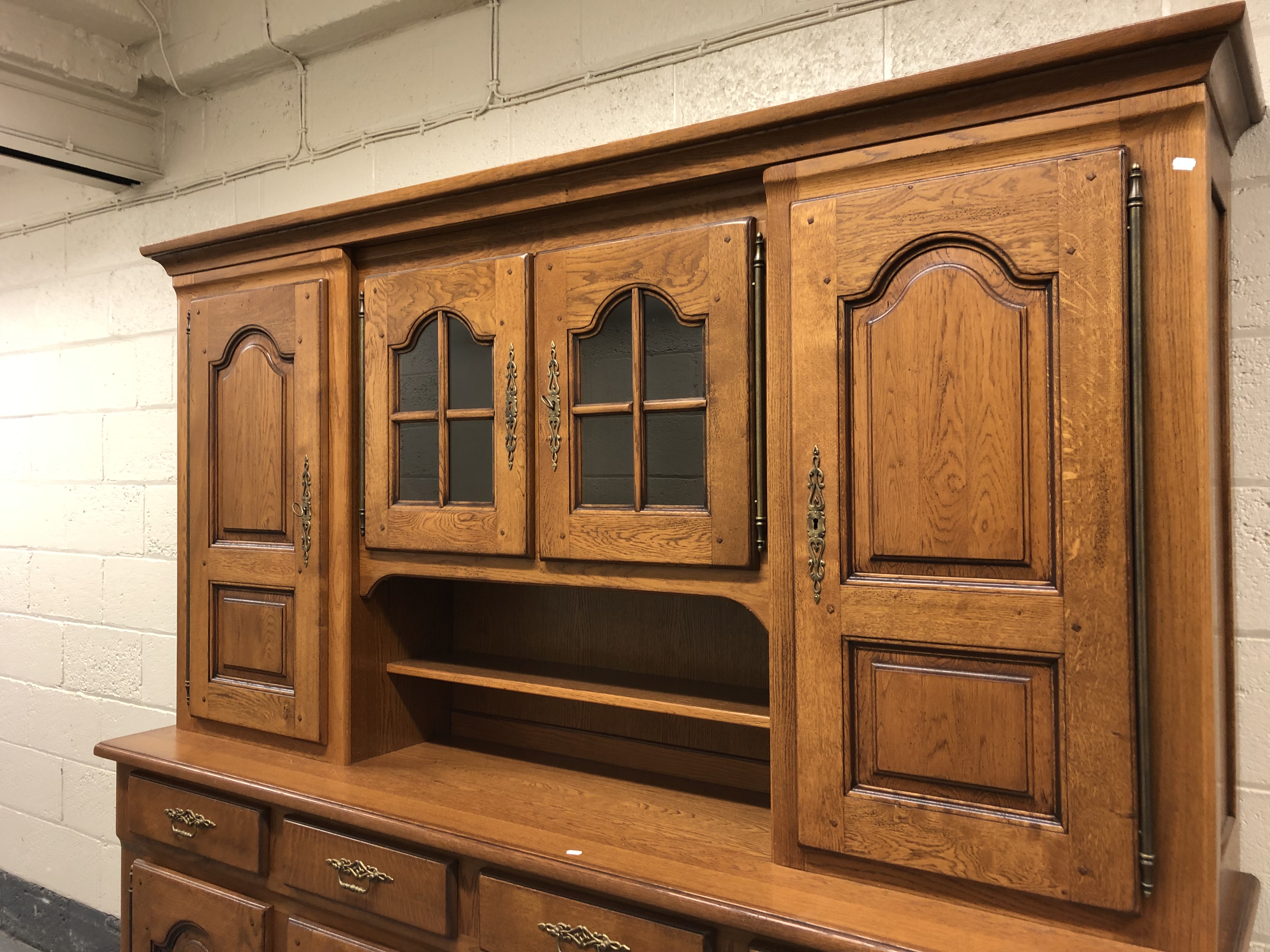 A 20th century oak dresser fitted eight cupboards and four drawers with brass bow handles, - Image 2 of 4