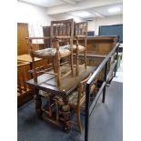 A carved oak buffet back sideboard on bulbous legs together with matching extending dining table