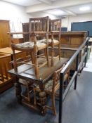 A carved oak buffet back sideboard on bulbous legs together with matching extending dining table