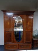 A 19th century inlaid mahogany mirror door wardrobe fitted two drawers beneath