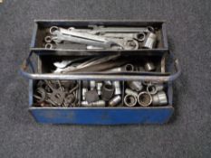 A metal concertina tool box containing socket sets and spanners