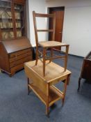 A mid 20th century two tier tea trolley together with an Edwardian bergere seated bedroom chair.