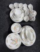 Two trays containing fifty-four pieces of Aynsley Cottage Garden tea and dinner china