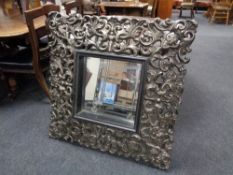 A Rococo style mirror in composite frame