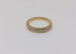 A 9ct gold diamond set half eternity ring, size J CONDITION REPORT: 1.