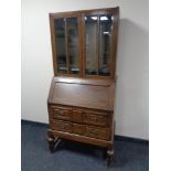 An Edwardian oak bureau bookcase.