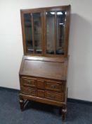 An Edwardian oak bureau bookcase.