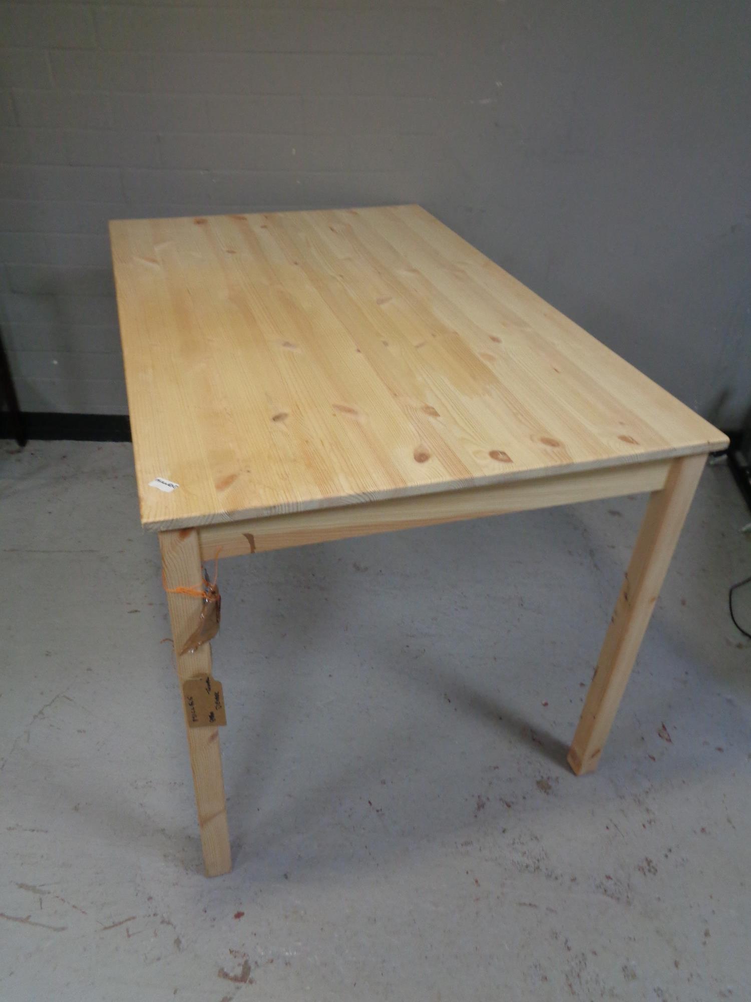 An Ikea pine kitchen table