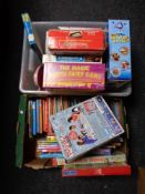 Four boxes containing children's books and annuals, board games etc.