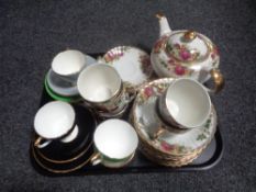 A tray containing four Sheridan china trios together with twenty-two pieces of English Rose