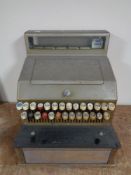 A vintage Gross pre decimal cash register with key.