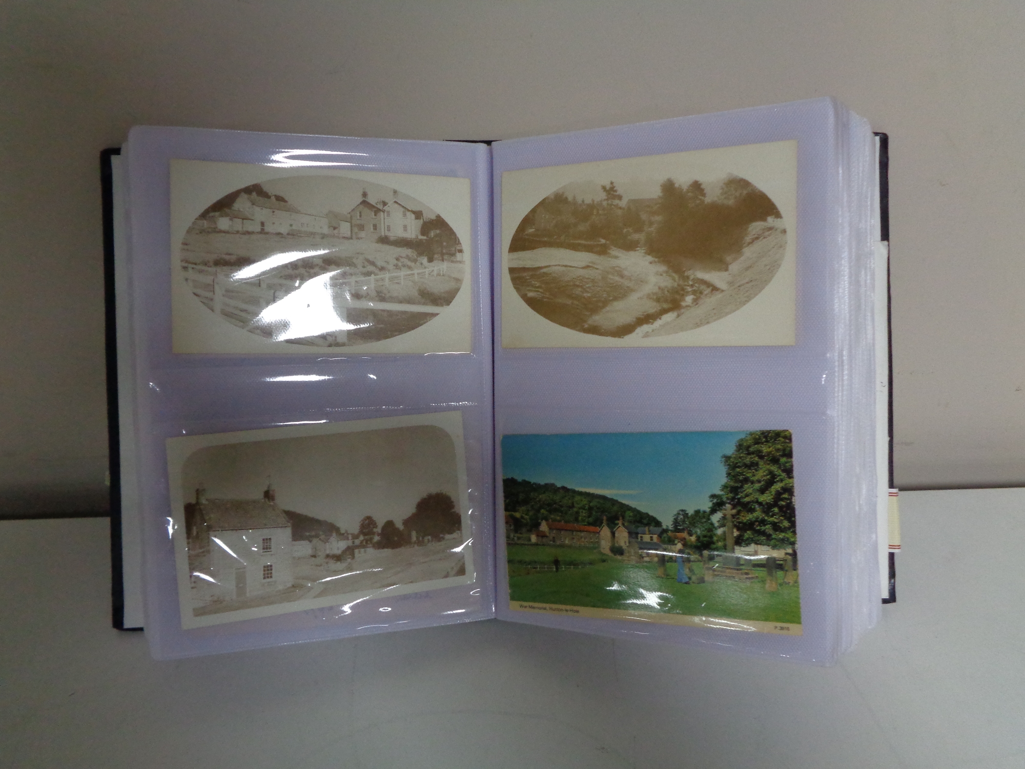 An album containing antique and later postcards, Scarborough, Whitby, Yorkshire etc.