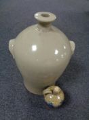 An antique glazed pottery flagon together with a further glazed pottery Portuguese jug.