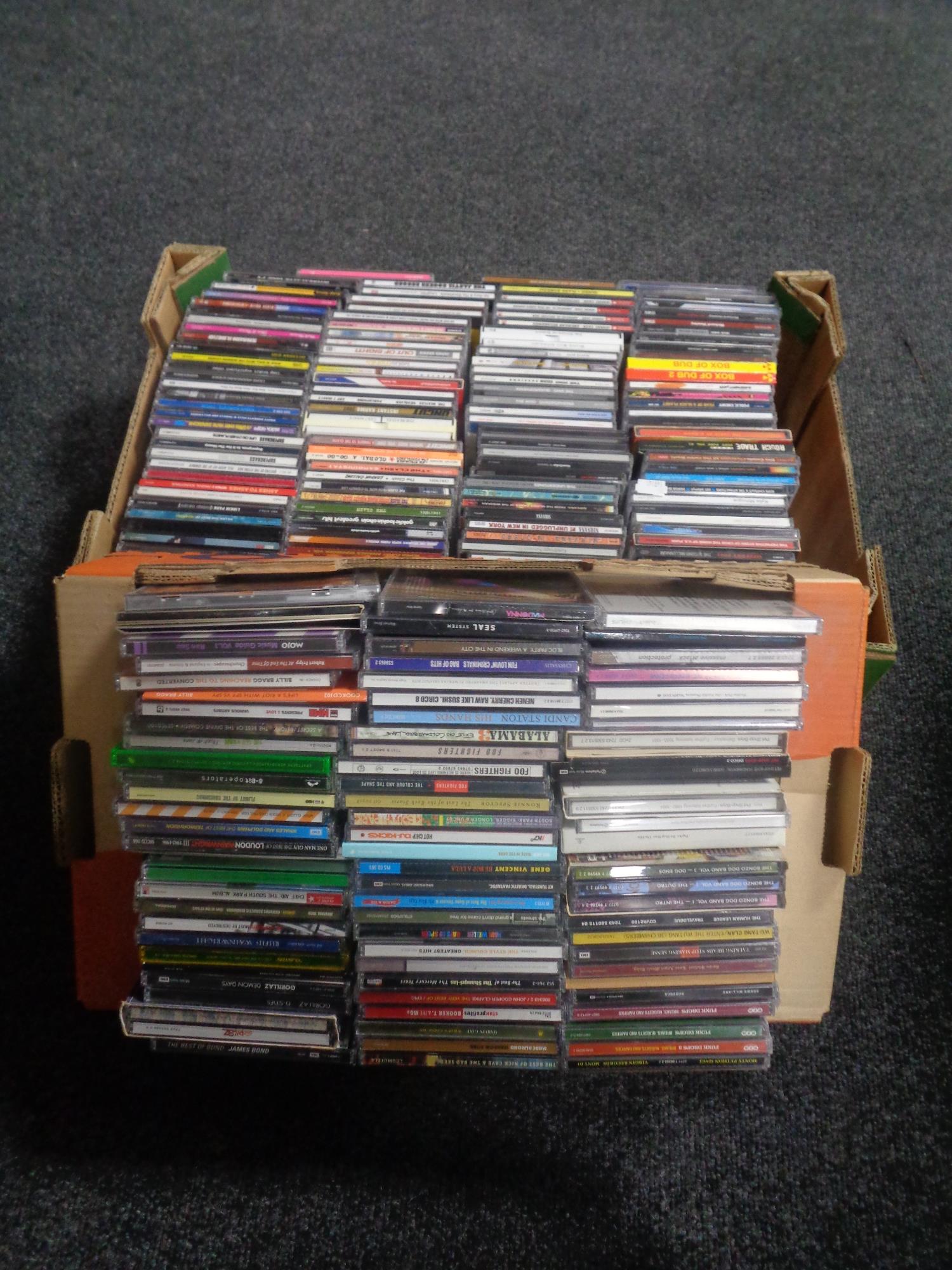 Two boxes of assorted CD's and movie soundtracks