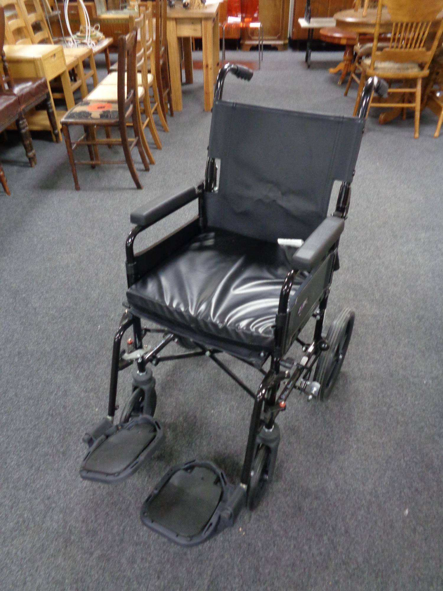 A folding wheelchair.