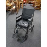 A folding wheelchair.