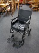 A folding wheelchair.