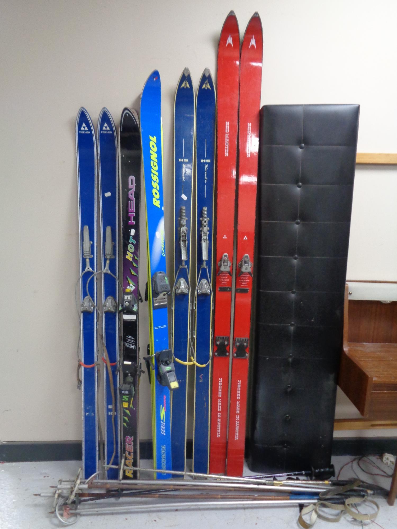 Five pairs of skis to include Rossignol, Fischer etc, together with ski poles.