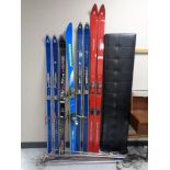 Five pairs of skis to include Rossignol, Fischer etc, together with ski poles.