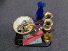 A tray containing assorted brass ware, early 20th century cutlery,