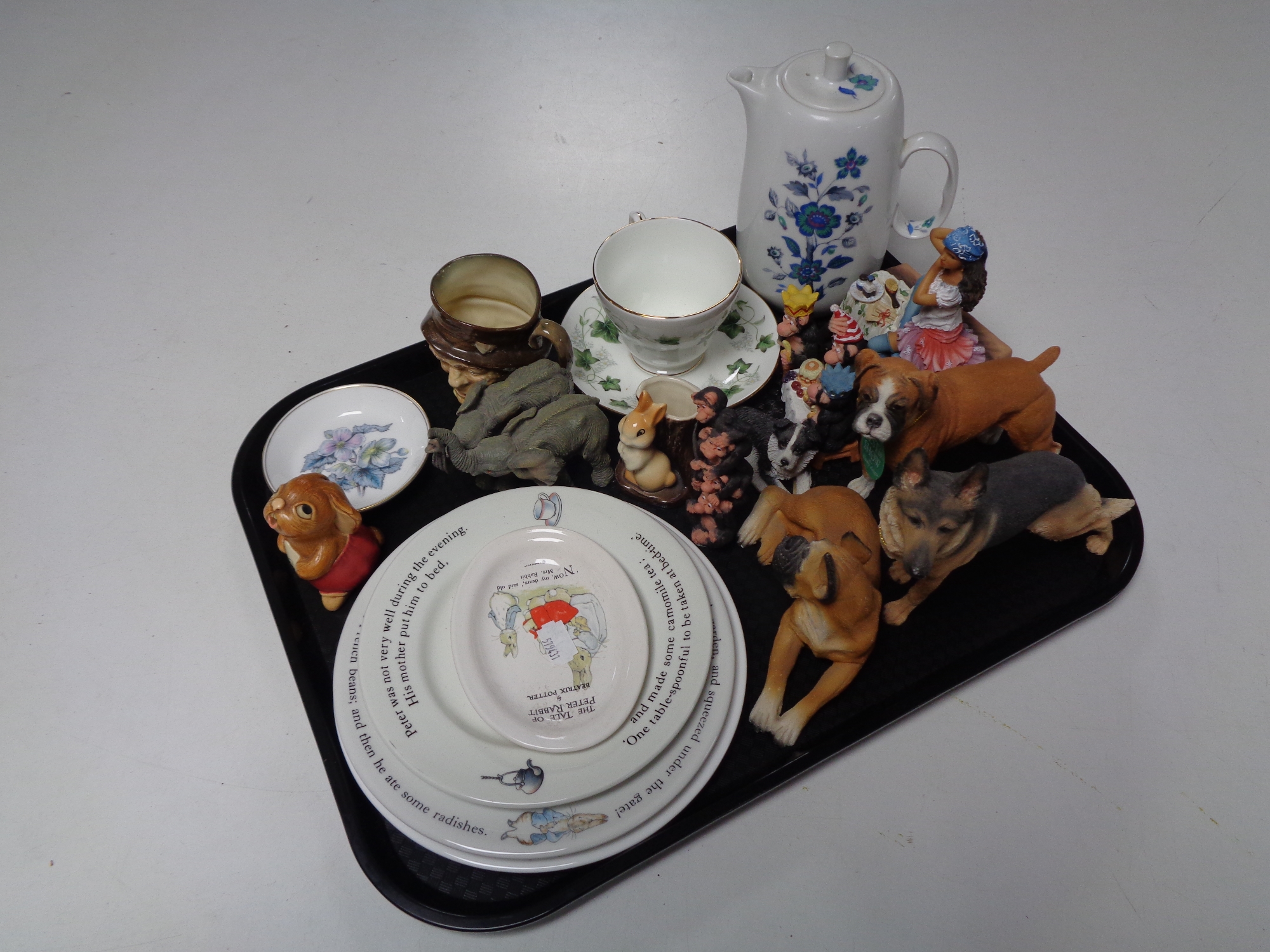 A tray containing miscellania to include Wedgwood Peter Rabbit plates, miniature Hornsea spill vase,