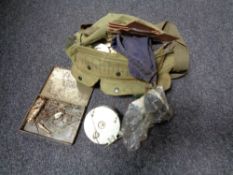 A fishing bag containing fishing reel, line, hooks, tins of flies etc.